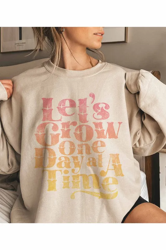 LET'S GROW ONE DAY GRAPHIC SWEATSHIRT